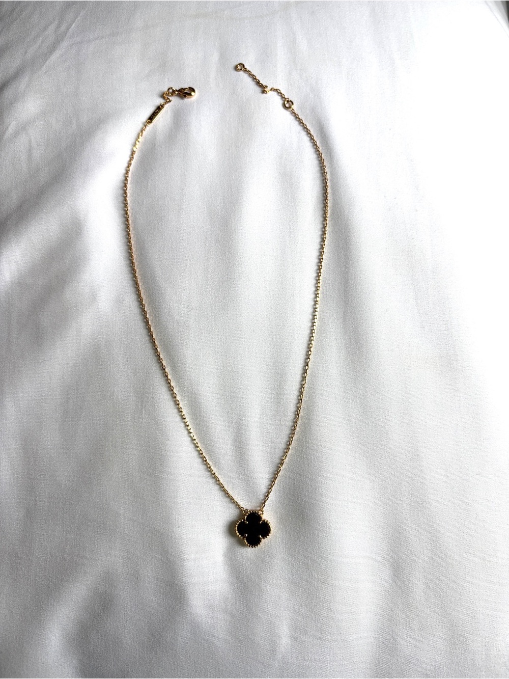 Black 4 leaf clover necklace with gold chain